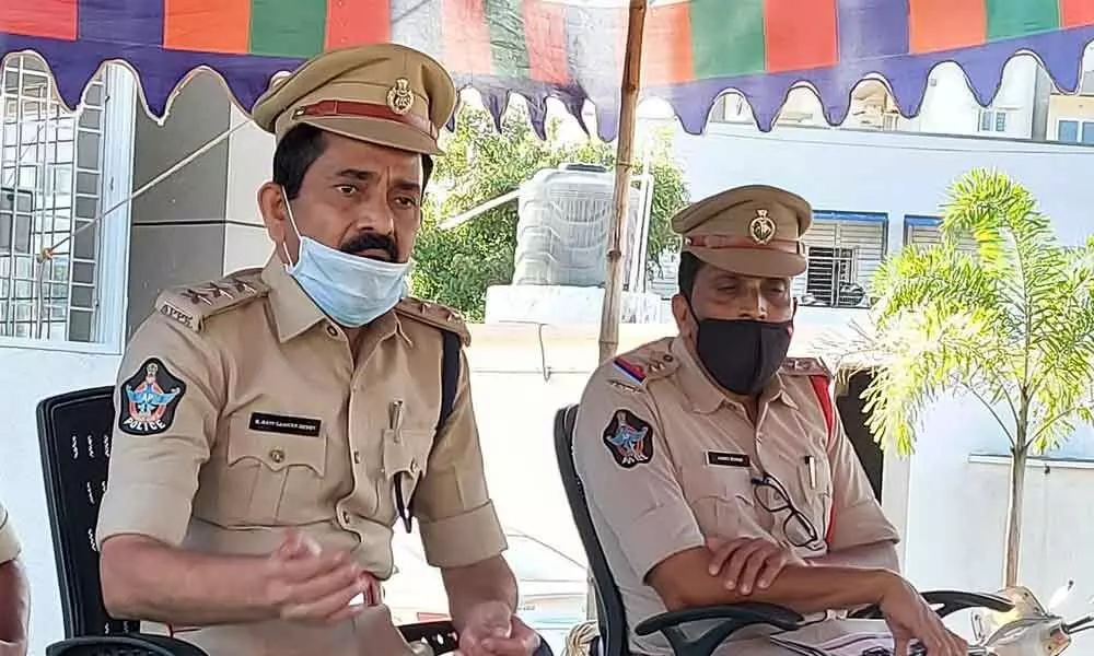 PM Palem police station officers sharing details of land grabbing case in Visakhapatnam