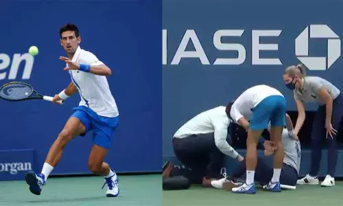 Djokovic disqualified after hitting line official with ball