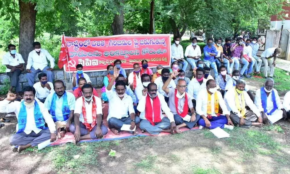 CPI leaders staging a dharna demanding protection to Dalits at the Collectorate in Chittoor on Monday
