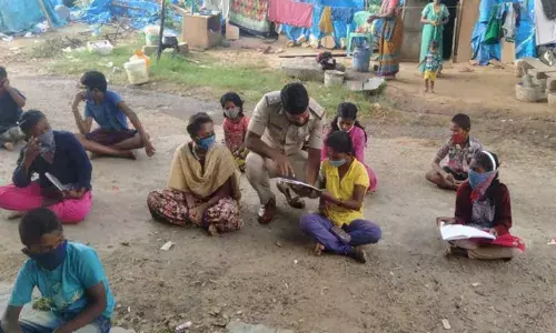 Teacher in khaki:  Meet Shantappa who holds gun and chalk with ease