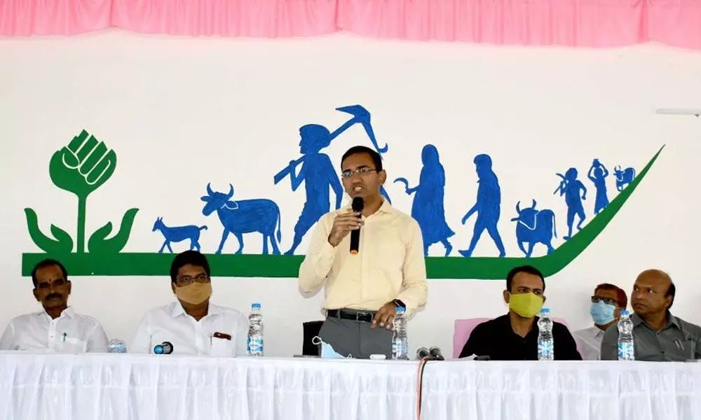 District Collector Musharraf Ali Farooqui speaking at a review meeting on double bedroom construction, at the Collector’s conference hall in Nirmal on Tuesday