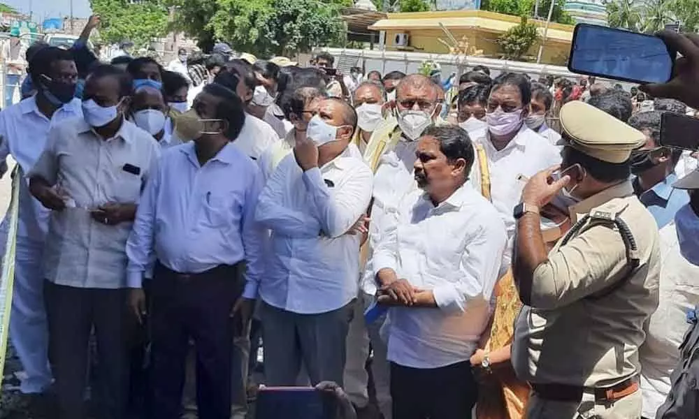 Ministers Vellampalli Srinivas,Pinipe Viswaroop and Ch Venugopalakrishna inspecting the burnt chariot at Antarvedi on Tuesday