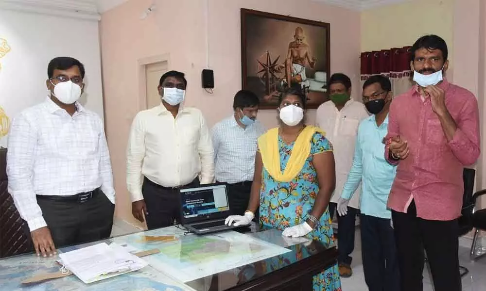 District Collector K V N Chakradhar Babu launching covidenquiry.com in Nellore on Wednesday