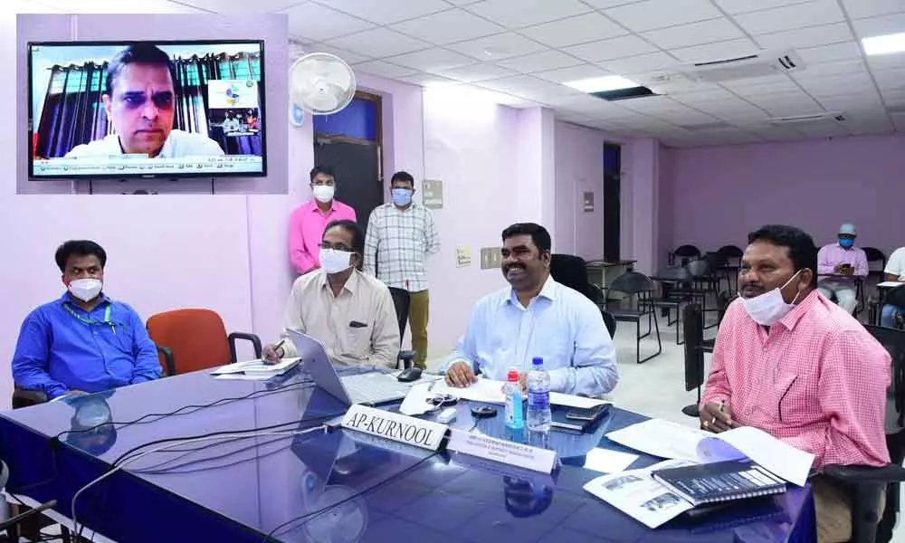 District Collector G Veera Pandiyan presenting the success story of Tadakanapalle village through video conference, in Kurnool on Wednesday
