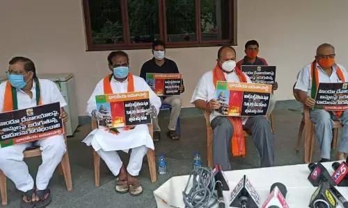 BJP state former president Kanna Lakshminarayana, former ministers Ravela Kishore Babu, Dr Sanakkayala Aruna and others participating in Deeksha in Guntur on Thursday