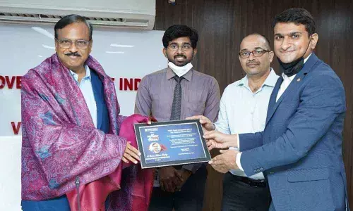 HDFC Bank officials felicitating VSEZ Development Commissioner A Rammohan Reddy at Duvvada