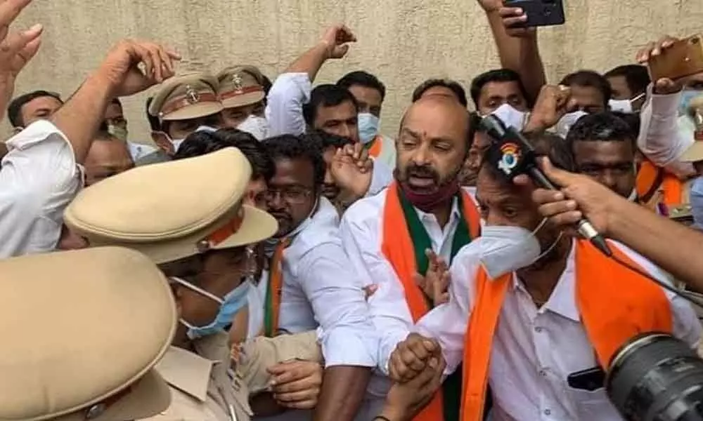 BJP State unit president Bandi Sanjay Kumar being detained by police while on his way to Assembly in Banjara Hills on Friday