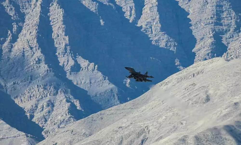An IAF aircraft flies in the Ladakh region amid the India-China stand off, in Leh on Friday