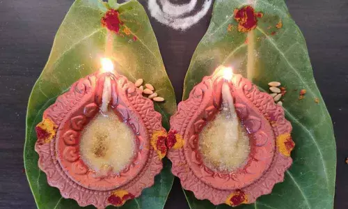 Many prayed during rare planetary confluence, lighting earthen lamps on jilledu aaku in Visakhapatnam on Sunday	Photo: Rani Devalla