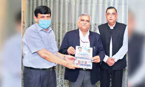 Principal Secretary Ajay Jain submitting report to EESL chairman Rajeev Sarma