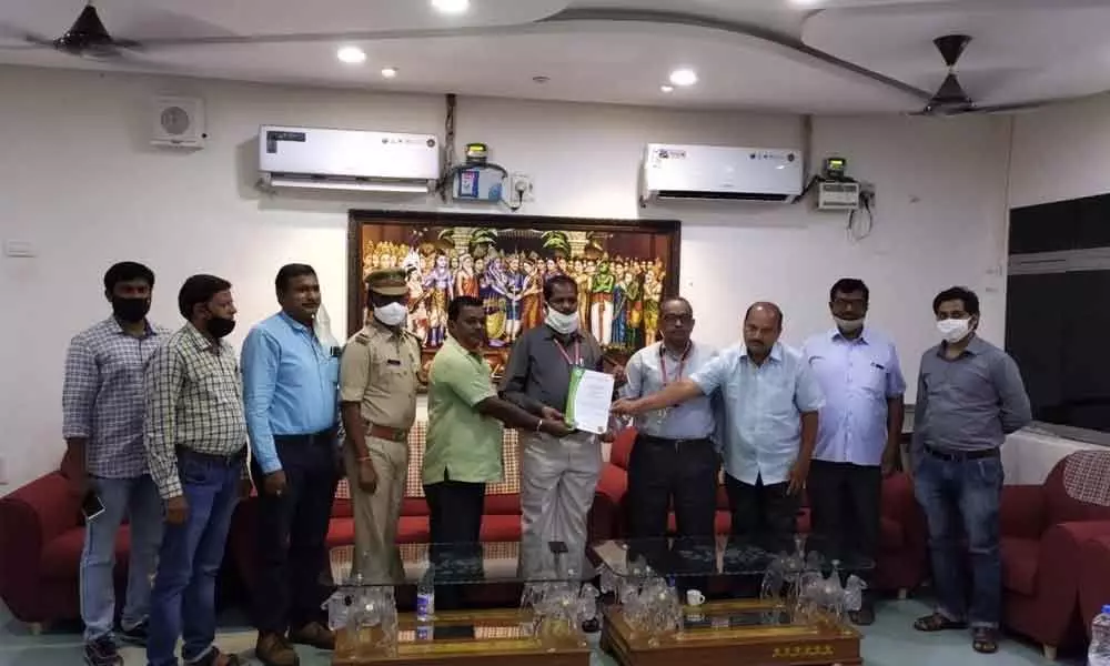 Sr DME PA Pushparaj handing over the ISO certificate to the station director  S Nagaramana Sarma in Tirupati on Sunday.