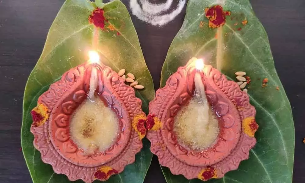 Many prayed during rare planetary confluence, lighting earthen lamps on jilledu aaku in Visakhapatnam on Sunday	Photo: Rani Devalla