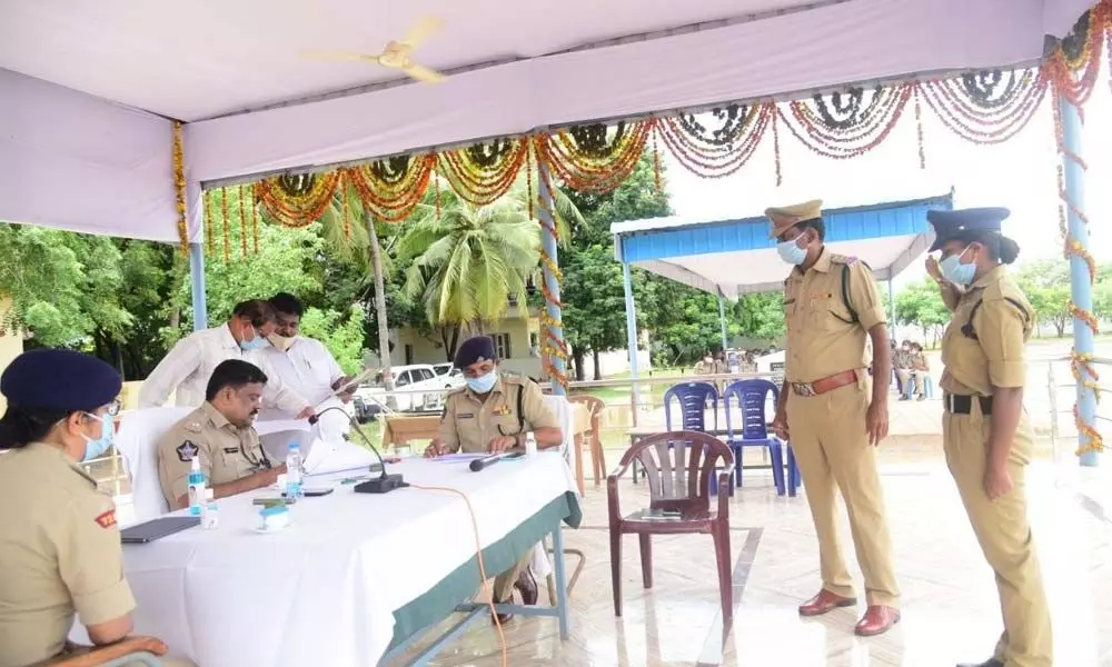 SP M Ravindranath Babu interacting with the cops after issuing posting orders to them in Machilipatnam on Monday