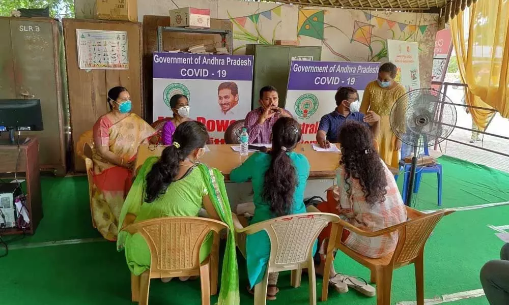 Joint Collector (development) V Veerabrahmam giving instructions to the staff on the information to be collected from home isolated patients (File photo)