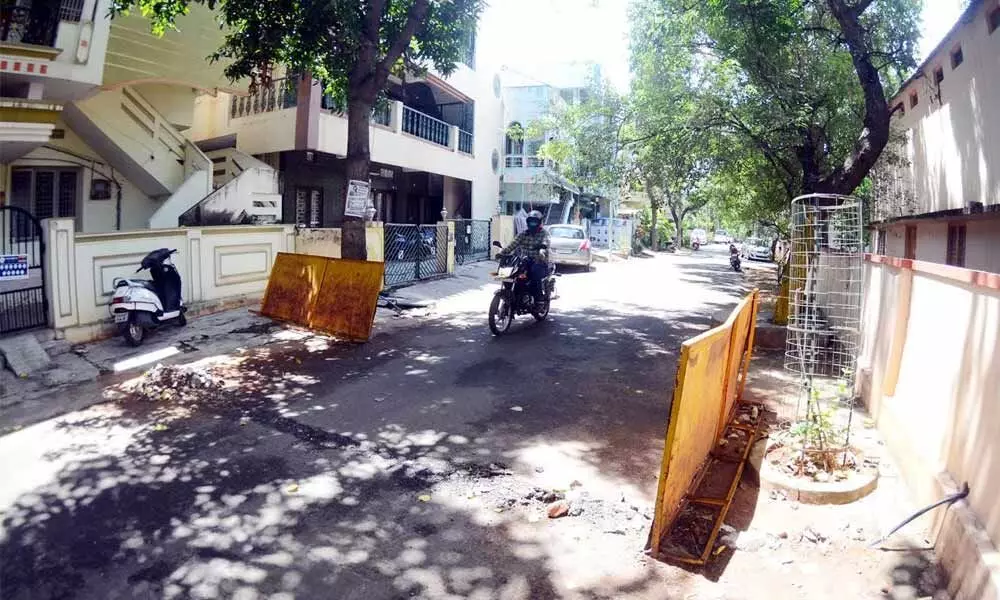 Stoppers brushed aside to make way for vehicle movement in a containment cluster in Visakhapatnam Photo: A Pydiraju