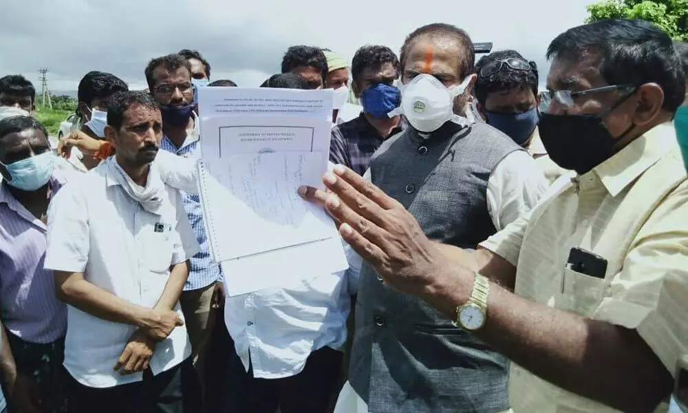 Irrigation officials explaining details of the high-level canal to Assembly Speaker Tammineni Sitaram