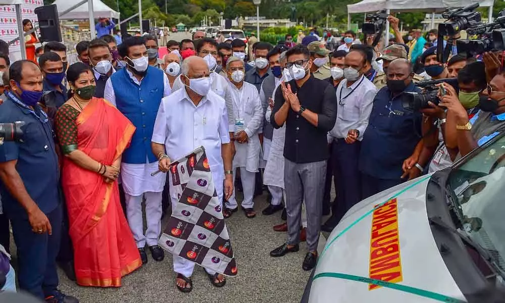 Karnataka Chief Minister B S Yediyurappa flags off 20 Ambulances, PPE Kits and HNFC machines at Vidhana Soudha in Bengaluru on Tuesday