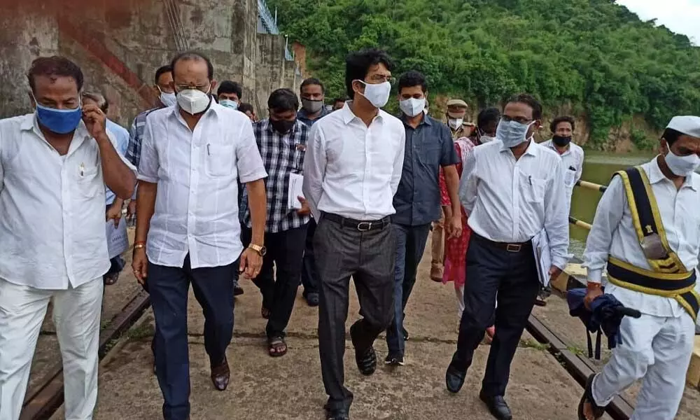 East Godavari District Collector D Muralidhar Reddy and Prathipadu MLA Parvata Purnachandra Prasad inspecting Appannapalem Bridge at Yeleswaram in East Godavari district on Tuesday