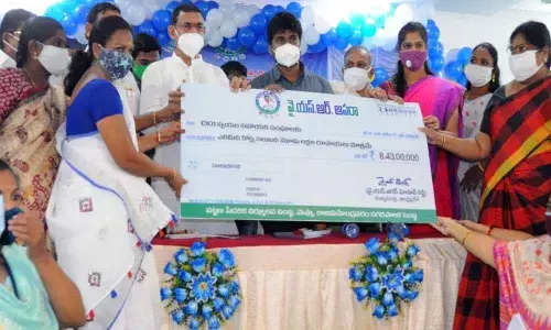 BC Welfare Minister C S V G Krishna distributing cheques to DWCRA members under  YSR Aasara in Rajamahendravaram on Wednesday
