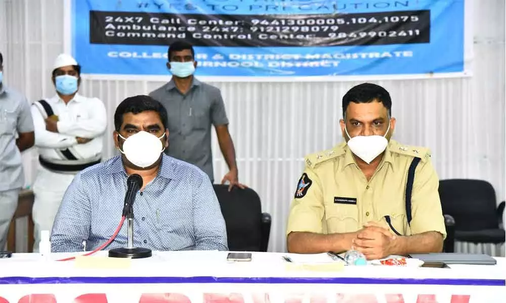 District collector G Veera Pandiyan addressing a press conference at Sunaina Auditorium in Kurnool on Wednesday. Superintendent of Police Dr Fakkeerappa Kaginelli is also seen