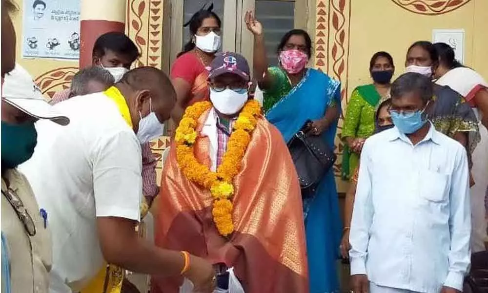 PHC medical officer Ravi Chandra being felicitated in Korukonda