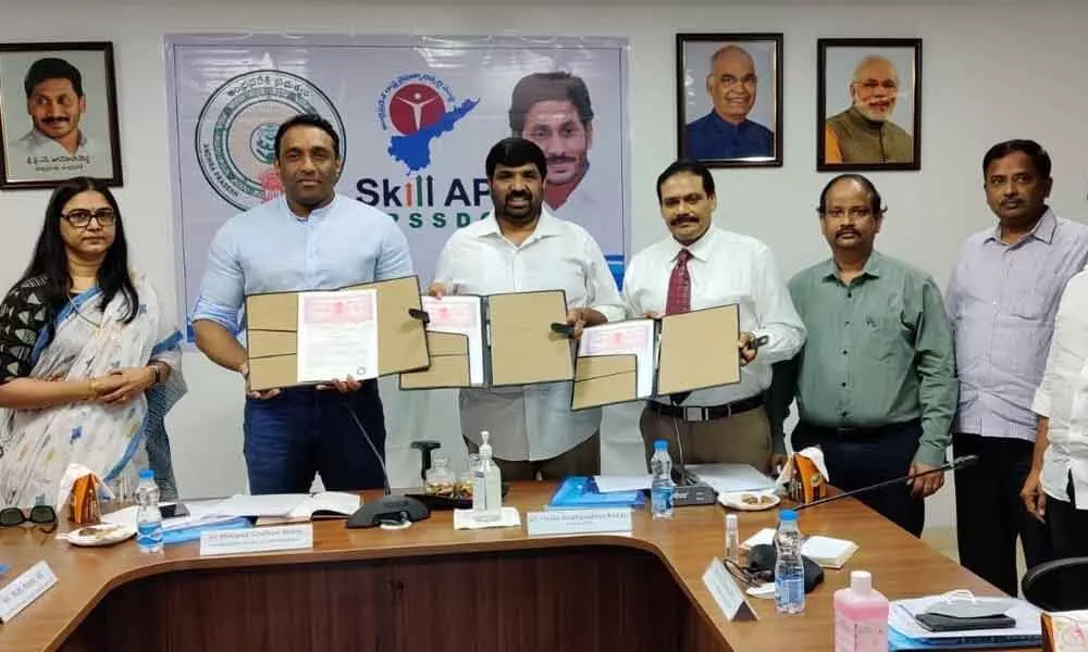 Minister for Industry Mekapati Gautam Reddy, APSSDC chairman Challa Madhusudan Reddy and CEO and MD Dr Arja Srikanth with the industry representatives to sign the MoU for skill development of youth at Tadepalli on Wednesday