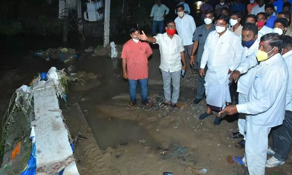 Agriculture Minister Singireddy Niranjan Reddy inspecting colonies and houses filled with rainwater in Wanaparthy on Thursday