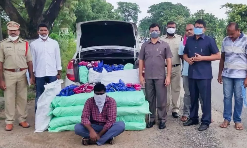 Taskforce police along with seized tobacco products in Khammam on Thursday