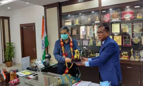 AP Central University VC S A Kori felicitating UGC Chairman D P Singh in Delhi