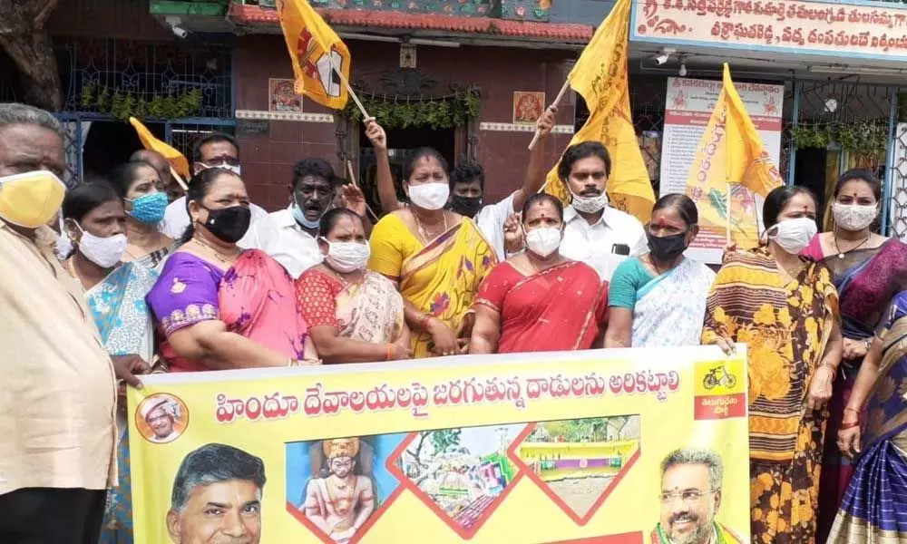 TDP leaders participating in a protest programme at Sri Kanaka Durga Temple in Kakinada on Friday
