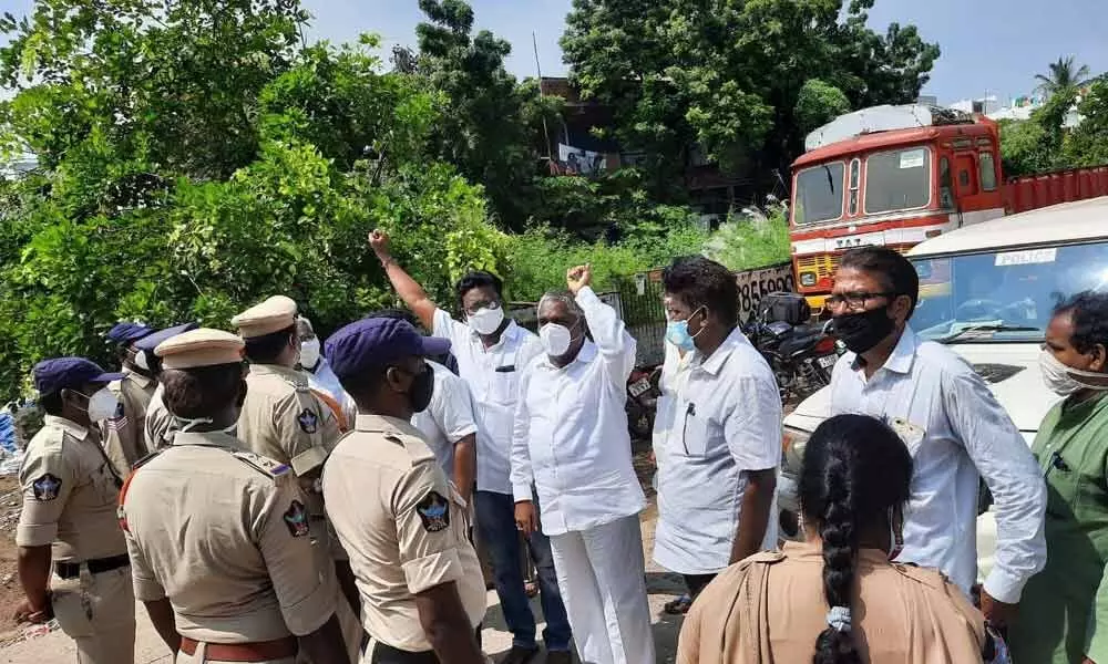 Police stopping the BJP activists while they were on their way to lay siege to the office of RDO in Amalapuram