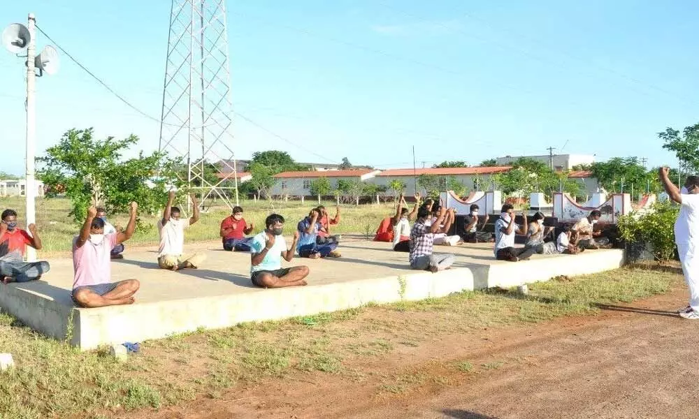 Yoga practice by the Covid patients at the Police COVID Care Centre in Ongole