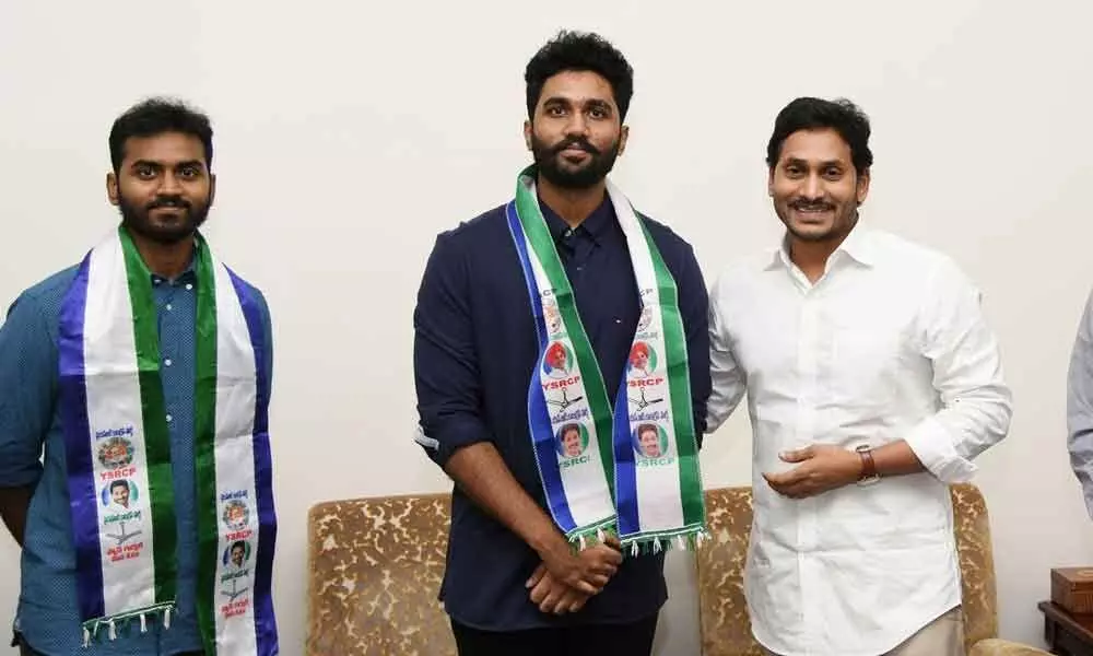 YSRCP president and Chief Minister Y S Jagan Mohan Reddy welcomes the two sons of Vizag South TDP MLA Vasupalli Ganesh (right) into YSRCP at his camp office in Tadepalli on Saturday