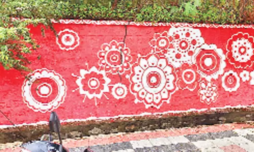 Tar roads and sidewalks with decorations on walls in Kukatpally