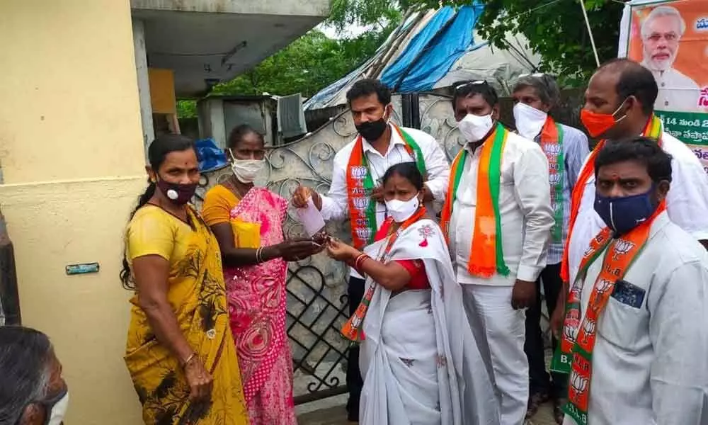 BJP State vice-president R Sridevi distributing glasses to the beneficiaries at Paramahamsa Yogananda Netralaya on Sunday