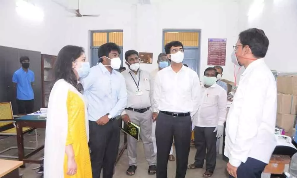 Collector D Muralidhar Reddy inspecting ward secretaries examination hall at the government college in Rajamahendravaram on Sunday