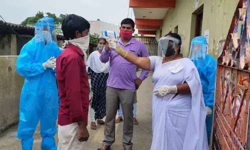 Village/ward secretariat exam aspirants are being screened with thermal scanner at exam centres in Vizianagaram on Sunday