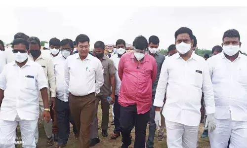 Minister for Fisheries S Appala Raju visiting lands suitable for proposed aqua university at Biyyaputippa