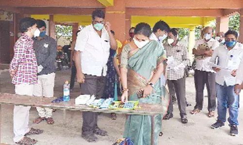 GMC Commissioner Challa Anuradha visiting a ward/village secretariat staff examination centre in Guntur on Sunday