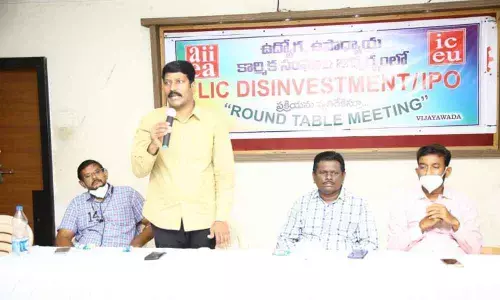 Leaders of All India Insurance Employees Association addressing the roundtable against the disinvestment of the Life Insurance Corporation of India in Vijayawada on Sunday
