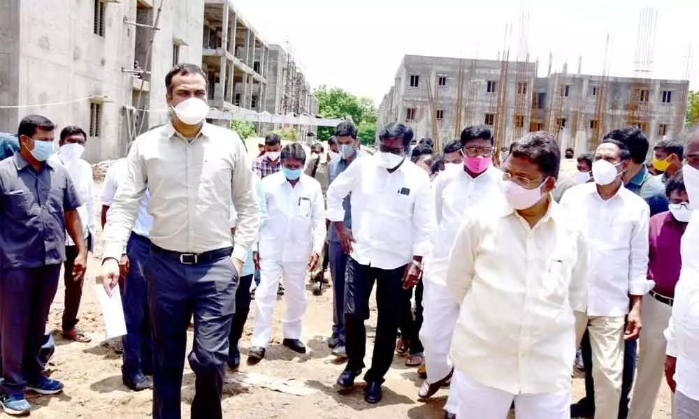 Transport Minister Puvvada Ajay Kumar and Collector RV Karnan inspecting the construction houses in the district (File Photo)