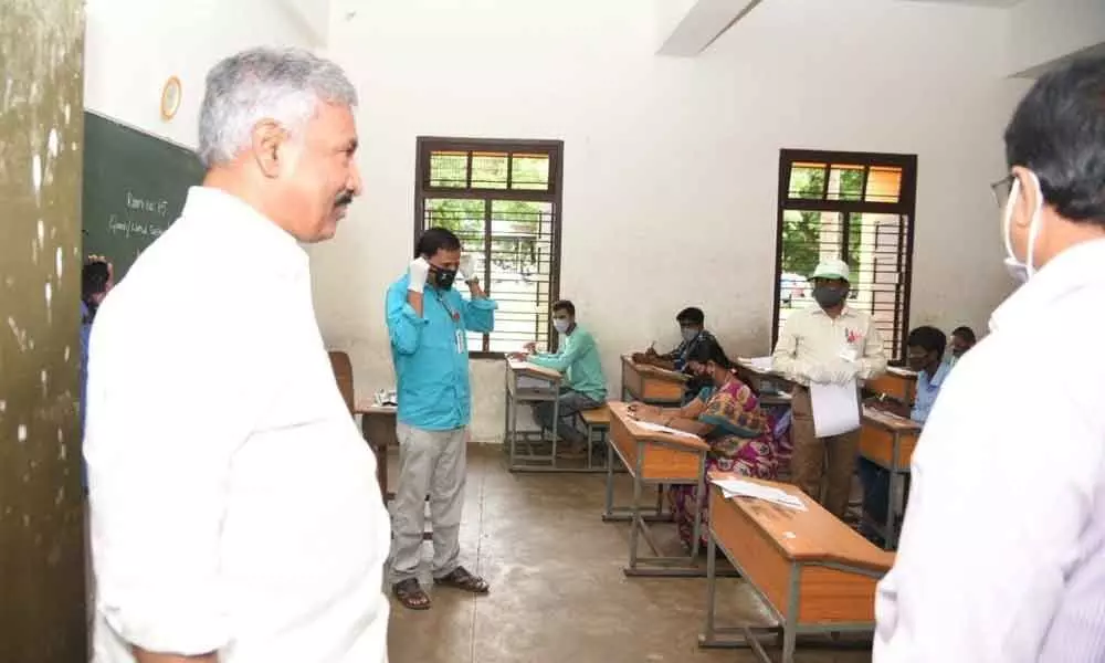 Minister for Panchayat Raj Peddireddy Ramachandra Reddy inspecting the village/ward secretariats posts examination centre at SV University campus school in Tirupati on Sunday