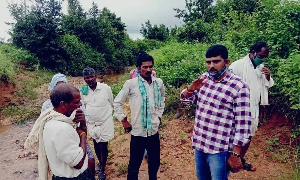 MPP Dr Kadire Sekhar Reddy interacting with farmers, who lost their crops due to heavy rains in Bhoothput on Monday