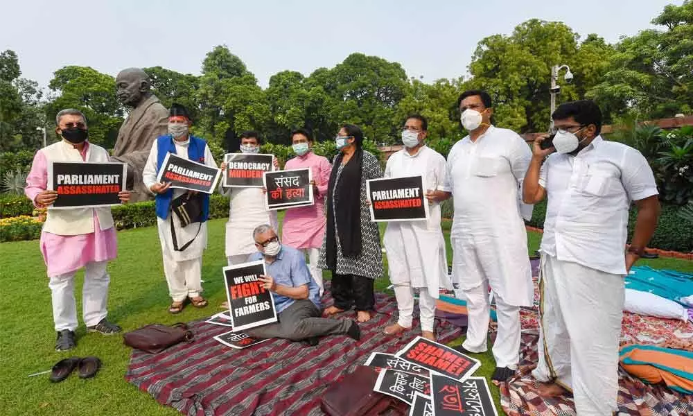 TMC MPs Derek OBrien and Dola Sen, National Conference MP Farooq Abdullah and others stage a protest over suspension of eight Rajya Sabha members in New Delhi on Monday