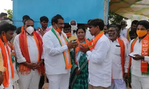 BJP State vice-president Y Lakshminarayana inviting people into the party in Jukkal on Monday
