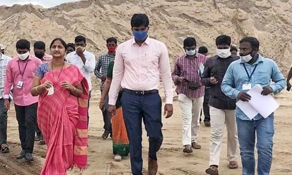 Joint Collector K Madhavi Latha and Vijayawada Sub-Collector HM Dhyana Chandra visiting a sand stock point at Ibrahimpatnam on Tuesday