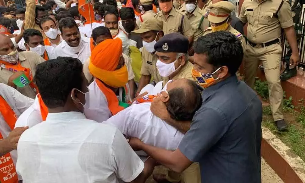 Police arresting BJP leaders, who were staging a dharna at the Collectorate in Karimnagar on Tuesday