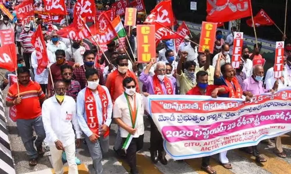 Members of trade unions taking out a rally in Visakhapatnam on Wednesday