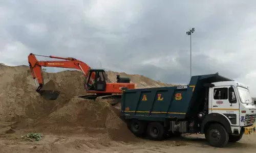 Sand being loaded into a tipper at a sand depot at West Ibrahimpatnam in Krishna district