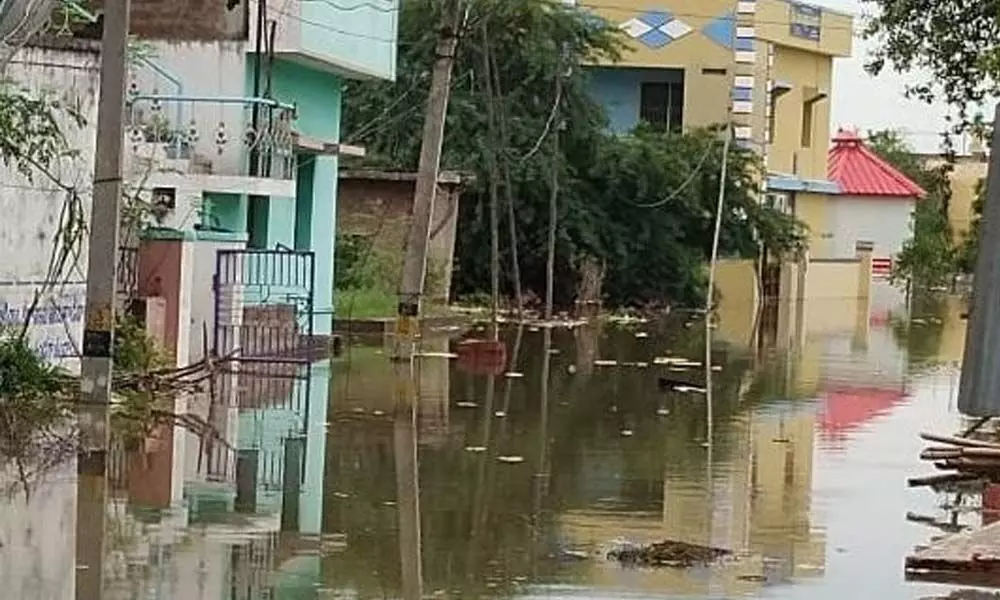 A street in Venkateswara Puram area inundated with floodwater from Penna river